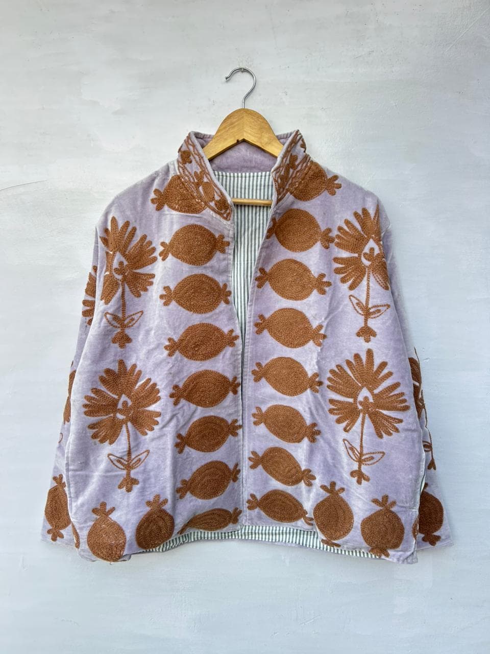 Kvastram textile jacket with repeated surface motif